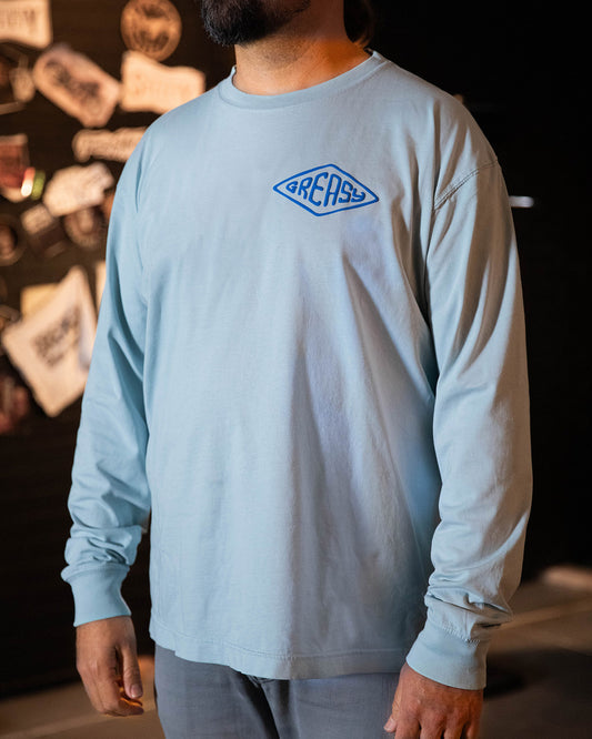 cross the line sky-blue long sleeved t-shirt with greasy in a diamond on the left chest